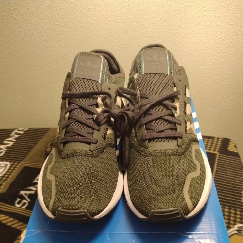 new in box size 13 US  Elevate your sneaker game with these Adidas Swift Run X